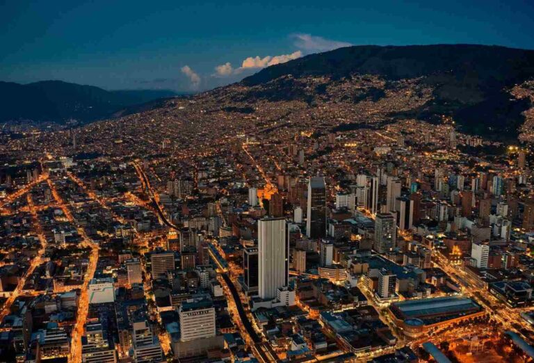 City lights illuminating the skyline of Medellín, Colombia at night.